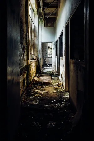 Explore The Eerie Ruins Of An Old Corridor. Wallpaper