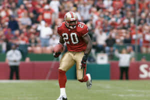 Explosive Nfl Running Back In Action Wallpaper