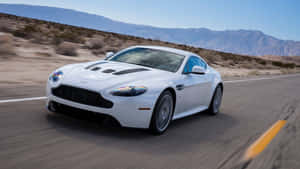 Exquisite Aston Martin V12 Vantage Cruising The Open Road Wallpaper