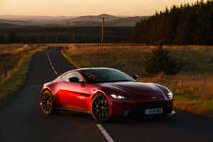 Exquisite Aston Martin Vantage Cruising The Open Road Wallpaper