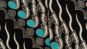 Exquisite Batik Creation With Turquoise Beads Wallpaper