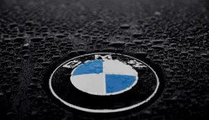 Exquisite Bmw Logo Emblazoned On A Sleek Bmw Car Wallpaper