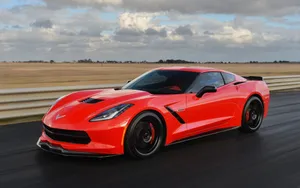 Exquisite Chevrolet Corvette C7 In Motion Wallpaper