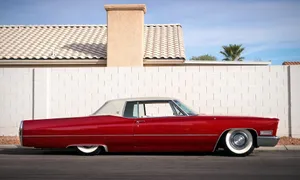 Exquisite Craftsmanship Of A Classic Cadillac Deville Wallpaper