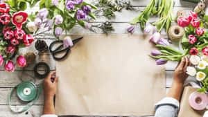 Exquisite Floral Arrangement On A Vintage Table Wallpaper