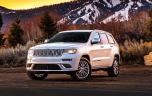 Exquisite Jeep Grand Cherokee Overcoming Rough Terrains Wallpaper