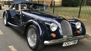 Exquisite Morgan Plus 8 Parked Under Clear Blue Sky Wallpaper