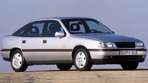 Exquisite Opel Vectra In Dynamic Driving Action Wallpaper