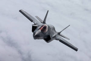 F-35a Fighter Jet In Action Wallpaper