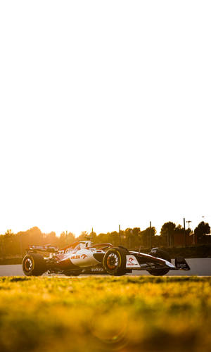 F1 Alfa Romeo C42 Sunset Iphone Wallpaper