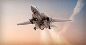 F14_ Jet_ Ascending_ Against_ Twilight_ Sky Wallpaper