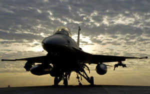 F16 Fighter Jet Silhouetteat Dusk Wallpaper