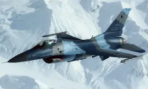 F16 Fighting Falcon Over Snowy Mountains Wallpaper