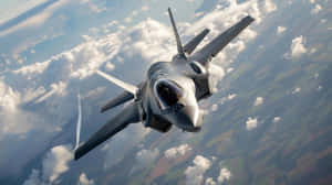 F35 Jet In Flight Over Clouds Wallpaper