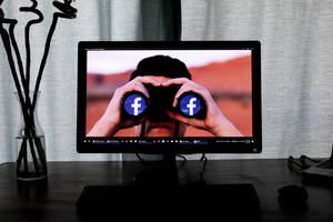 Facebook On Binoculars Wallpaper