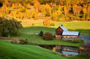Fall Barn - A Picturesque View Of An Old Rustic Barn Amidst The Vibrant Colors Of Autumn Wallpaper