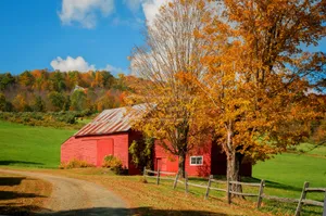 Fall Barn Amidst Picturesque Autumn Landscape Wallpaper