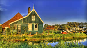 Fall Farmhouse In A Serene Landscape Wallpaper