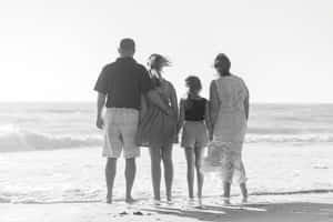 Family_ Beach_ Stroll_ Black_and_ White Wallpaper