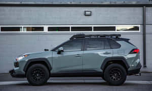 Family Driving In A Spacious Modern Car Wallpaper