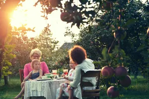 Family Garden Gathering Sunset Wallpaper