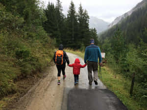 Family Hikingin Forest Path.jpg Wallpaper