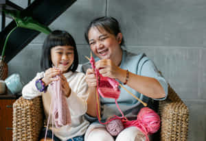 Family Knitting Time Together Wallpaper