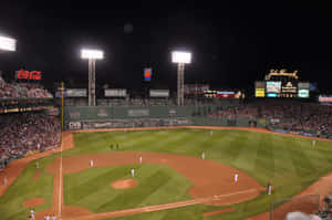 Fans Watching The Game At Fenway Park Wallpaper