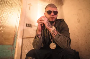 Farruko With A Golden Medallion Wallpaper
