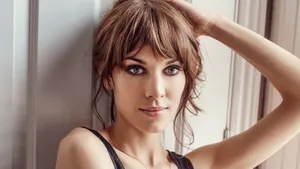 Fashion Icon Alexa Chung Strolling In Elegant Attire Wallpaper