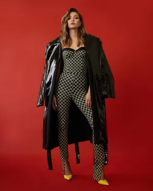 Fashion Modelin Checkered Jumpsuitand Glossy Coat Wallpaper