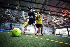 Fast-paced Indoor Soccer Action Wallpaper