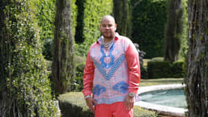 Fat Joe Standingin Garden Wallpaper