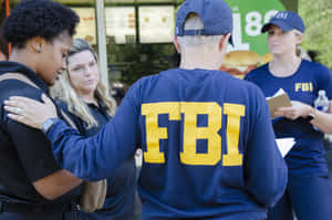 Fbi Agents In Uniform Standing Outside A Restaurant Wallpaper