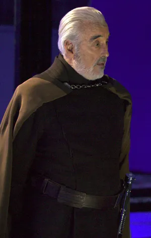 Fearless Count Dooku Wielding His Iconic Red Lightsaber Wallpaper