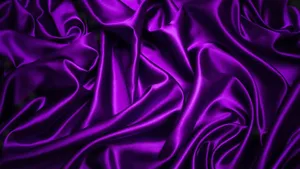 Feel The Luxury Of A Purple Satin Fabric. Wallpaper