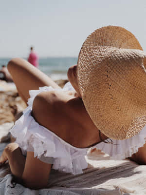 Feel The Sea Breeze In Style With A Beach Hat! Wallpaper
