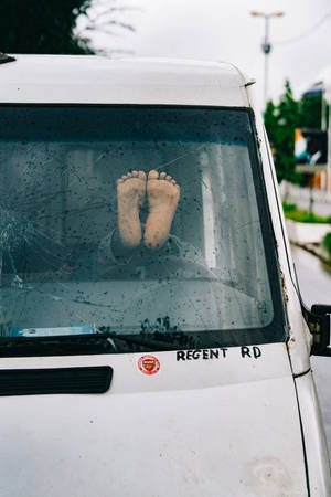 Feet On Van Windshield In Sierra Leone Wallpaper