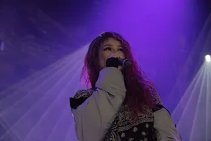 Female Artist Performing Live Concert Wallpaper