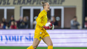 Female Goalkeeper Celebratingon Field.jpg Wallpaper