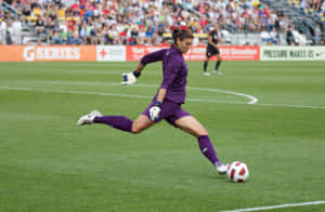 Female_ Goalkeeper_ Kicking_ Soccer_ Ball Wallpaper