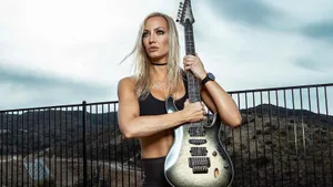 Female Guitarist Outdoor Portrait Wallpaper