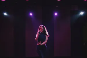 Female Singer Stage Performance Wallpaper