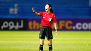 Female Soccer Referee Action Shot.jpg Wallpaper