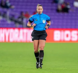 Female Soccer Refereein Action.jpg Wallpaper