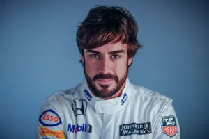 Fernando Alonso Geared Up In His Bright White Racing Suit Wallpaper