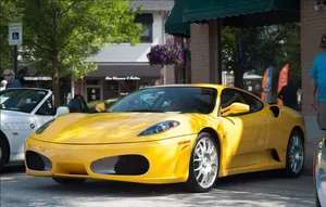 Ferocious Red Ferrari F430 Riding Through The Streets Wallpaper