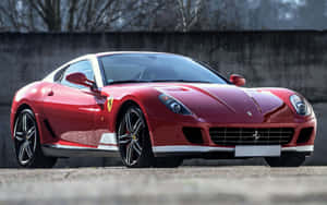 Ferrari 599 Gtb Fiorano Speeding Down The Road Wallpaper