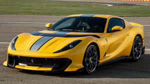 Ferrari 812 Superfast On A Scenic Road Wallpaper