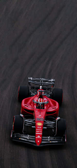 Ferrari F1 Racingon Track.jpg Wallpaper